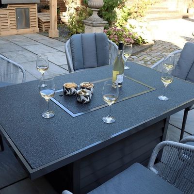 Metalen AJUNION 6 zitplaatsen Buitenmeubelen met vuurput Tafel en touw weef fauteuil